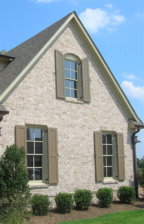 metal roof brich house|matching brick and roof colors.